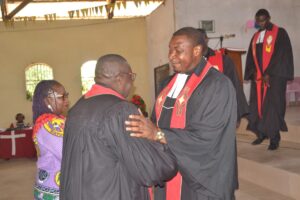 Rev. Emmanuel Masok, Right, Congratulates Rev. Eyakwe