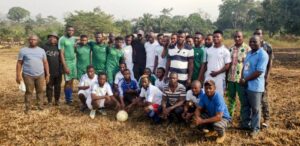 Football Players Pose with Officials at the Event