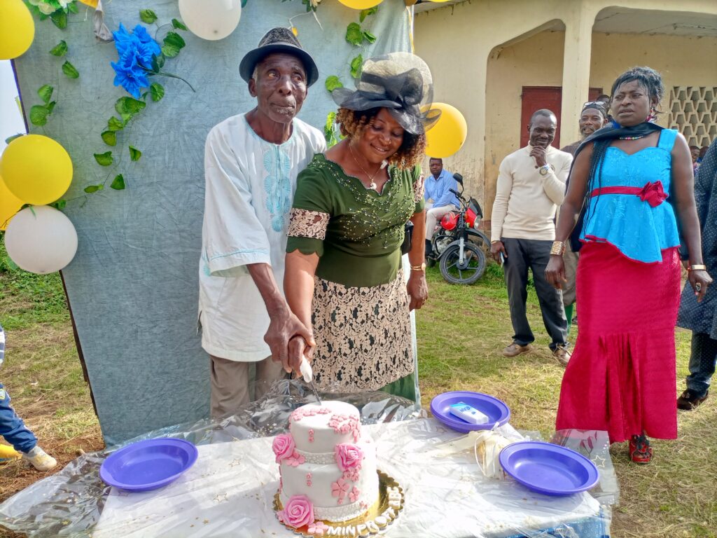 Mr. and Mrs. Gregogy Mbonde Cutting their Cake