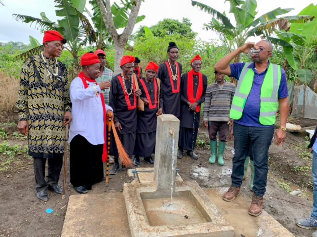 L-R, Chief Atabe, Elite & SW Regional Chief of General Affairs Drinking from Tap in Muangwekan
