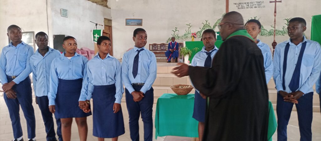 Rev Eyakwe Blessing the Students at Ceremony